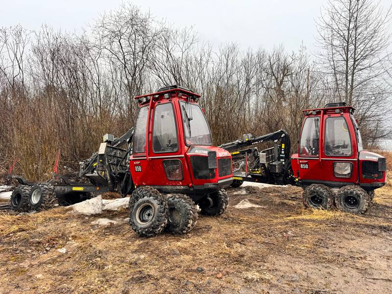 Two red compact forestry machines in the supplied equipment photograph